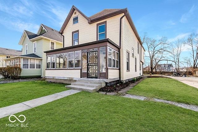 view of front of property with a front lawn