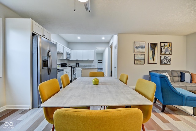 dining space featuring light hardwood / wood-style floors