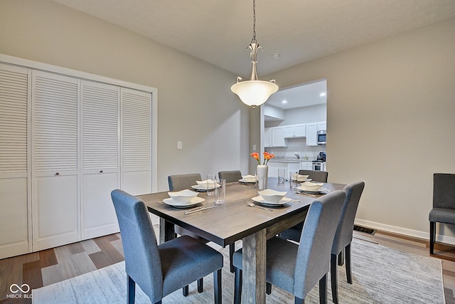 dining area featuring hardwood / wood-style floors