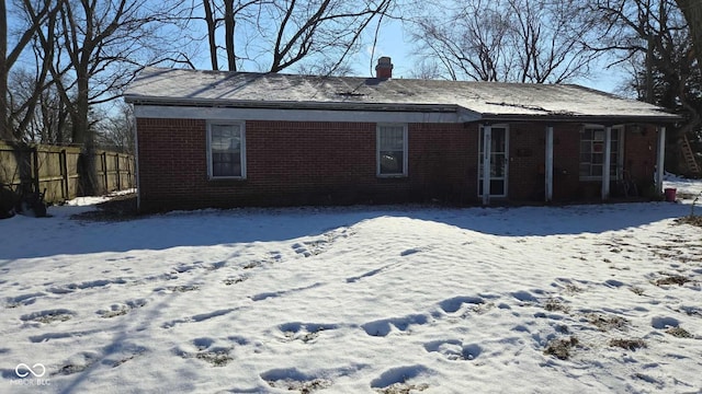 view of snow covered house