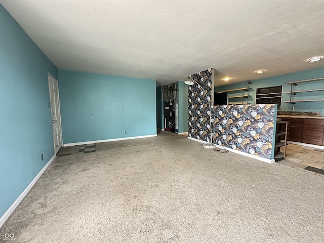 7903 Roseway Ct, Indianapolis, IN 46226 - unfurnished living room with carpet flooring, a textured ceiling, and baseboards