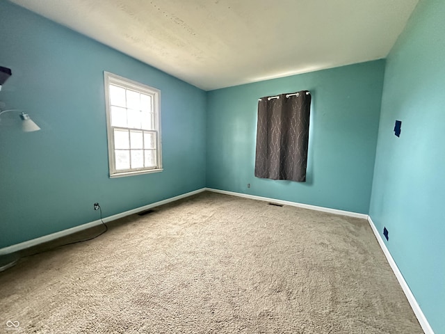 7903 Roseway Ct, Indianapolis, IN 46226 - carpeted spare room with visible vents and baseboards