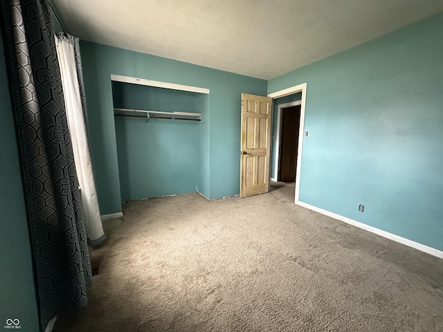 7903 Roseway Ct, Indianapolis, IN 46226 - unfurnished bedroom featuring a closet, baseboards, and carpet floors