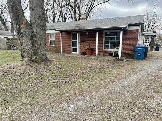 7903 Roseway Ct, Indianapolis, IN 46226 - single story home with fence, brick siding, driveway, and a chimney