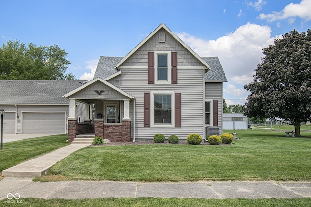 view of front of home with a garage, a porch, central AC unit, and a front lawn