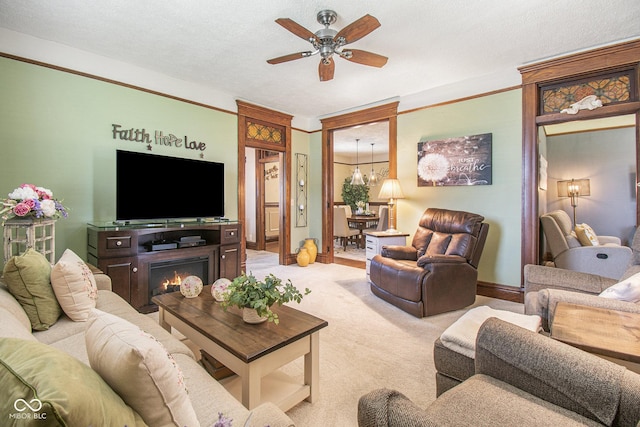 living room with ceiling fan with notable chandelier, light carpet, and a textured ceiling