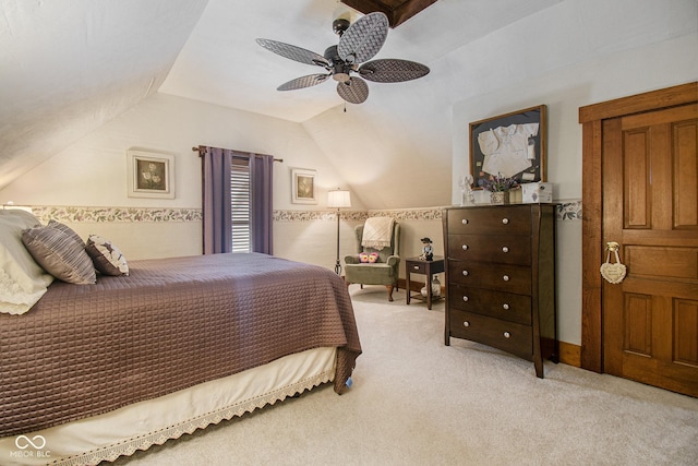 carpeted bedroom featuring ceiling fan and vaulted ceiling