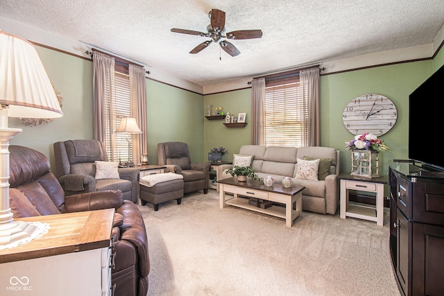 living room featuring light carpet, ceiling fan, and a textured ceiling