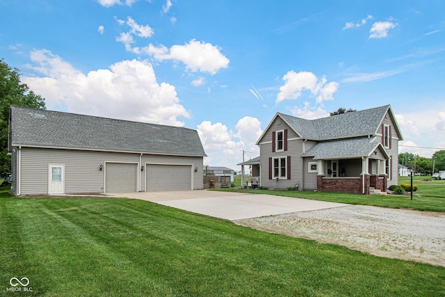 view of front of property featuring a garage and a front lawn