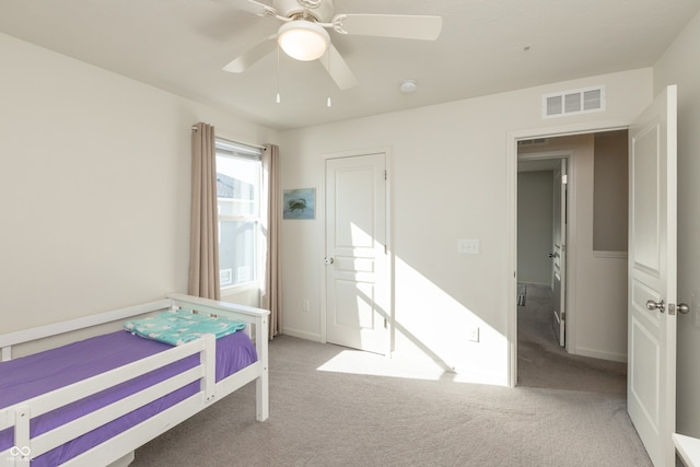 unfurnished bedroom with ceiling fan and light carpet