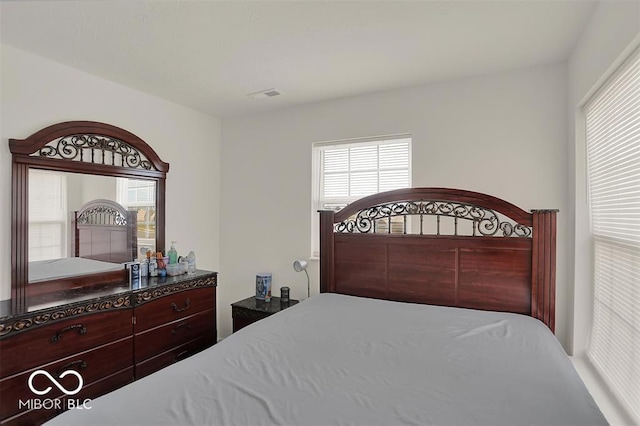 bedroom featuring multiple windows