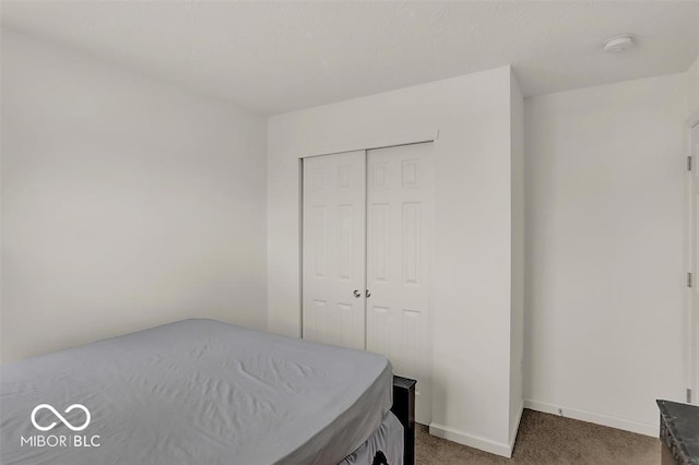 carpeted bedroom with a closet