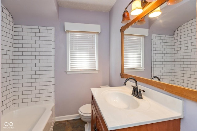 full bathroom with tile patterned floors, toilet, vanity, and tiled shower / bath combo