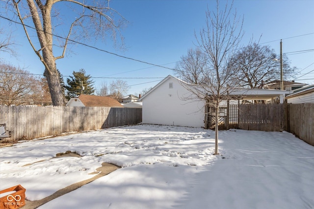 view of yard layered in snow