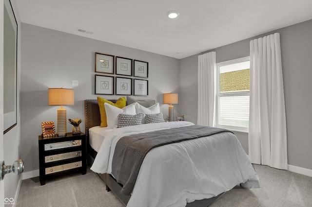 bedroom with light colored carpet