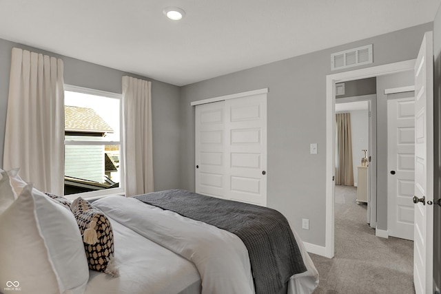 carpeted bedroom featuring a closet