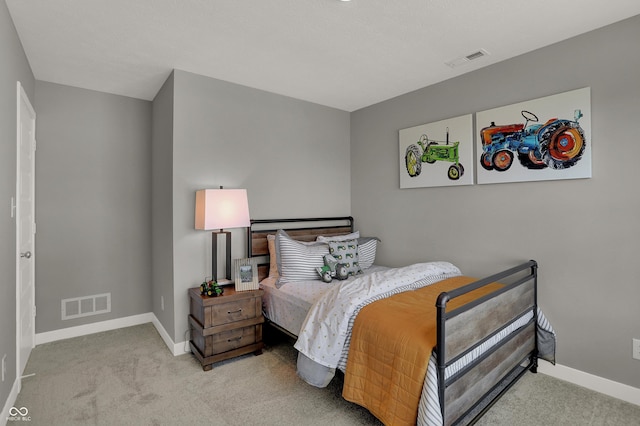 bedroom featuring light colored carpet