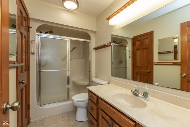 full bath with toilet, a stall shower, and vanity