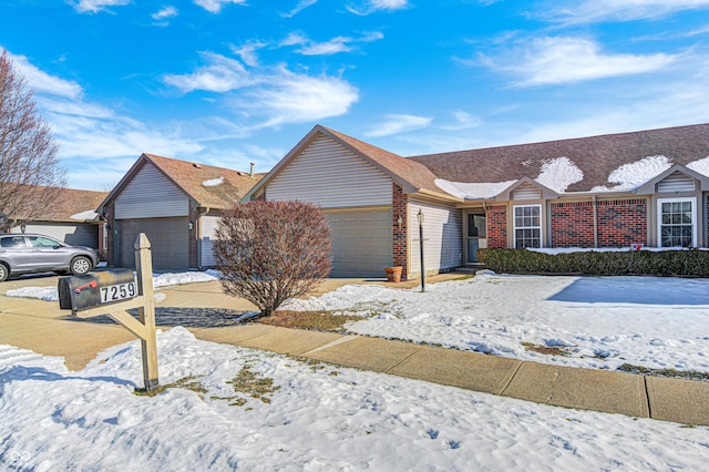 ranch-style house featuring a garage