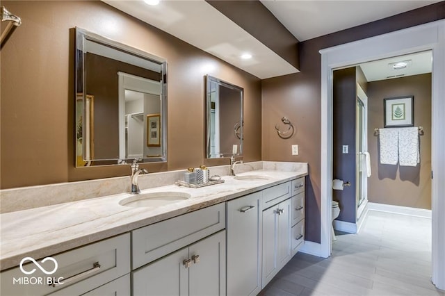 bathroom with vanity and toilet