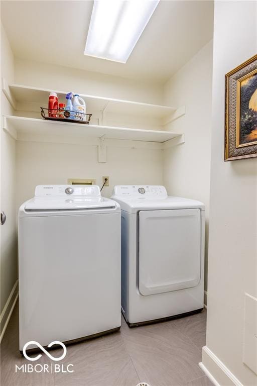 washroom with washer and clothes dryer