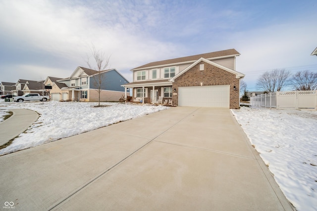 view of property featuring a garage and a porch