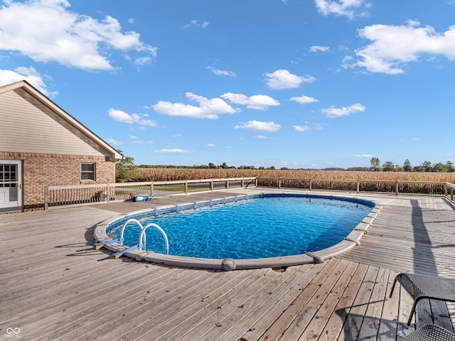 view of swimming pool featuring a wooden deck