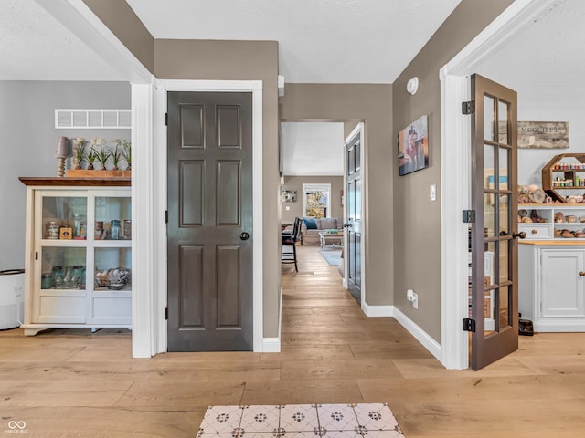 entrance foyer with light hardwood / wood-style flooring