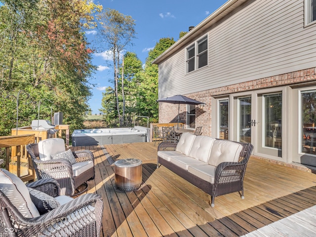 wooden terrace with a hot tub and an outdoor hangout area