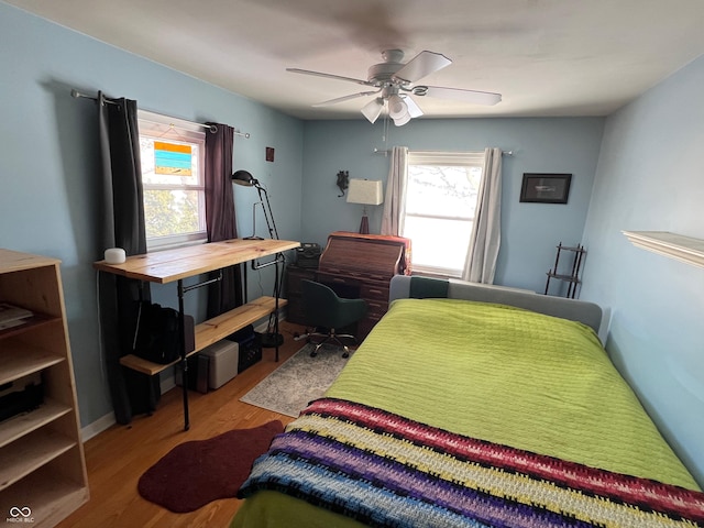 bedroom featuring ceiling fan and light wood-type flooring