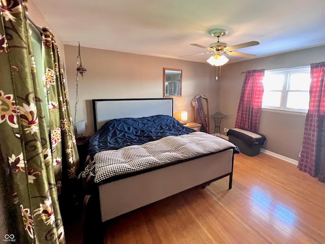 bedroom featuring ceiling fan and light hardwood / wood-style flooring