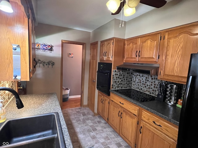 kitchen featuring tasteful backsplash, ceiling fan, sink, and black appliances