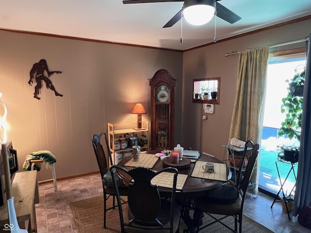 dining room with ornamental molding and ceiling fan