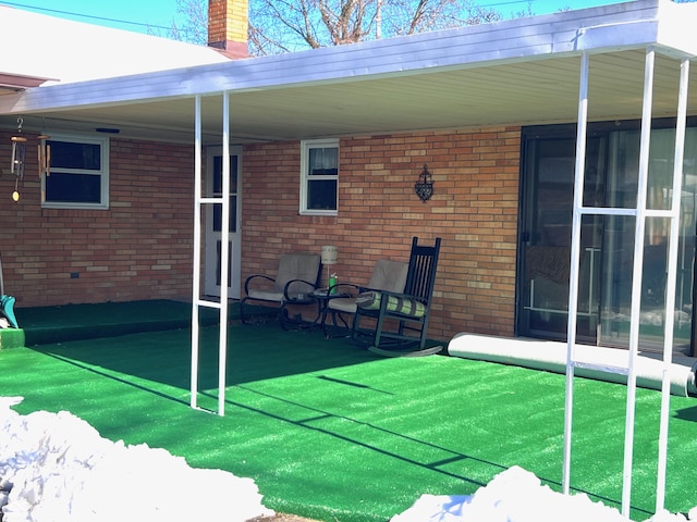 back of house featuring a yard