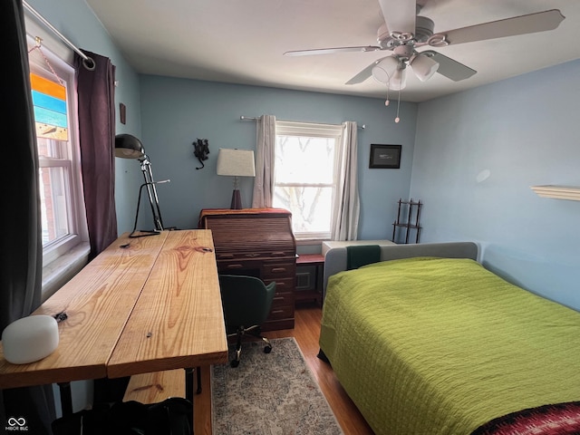 bedroom featuring wood-type flooring and ceiling fan