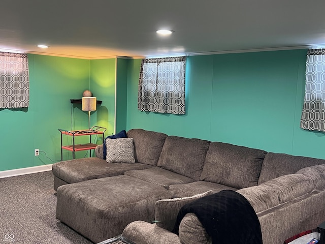 living room featuring ornamental molding and carpet