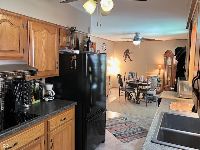 kitchen with sink, black appliances, and ceiling fan