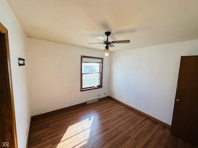 unfurnished room with ceiling fan and dark hardwood / wood-style floors