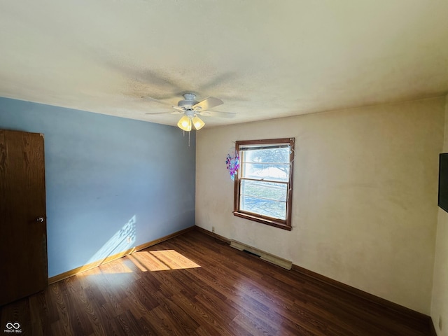 unfurnished room featuring ceiling fan and dark hardwood / wood-style floors