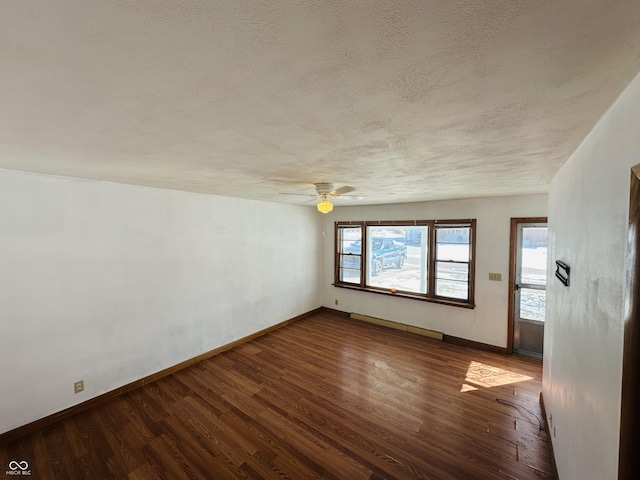 empty room featuring a textured ceiling, ceiling fan, and wood-type flooring