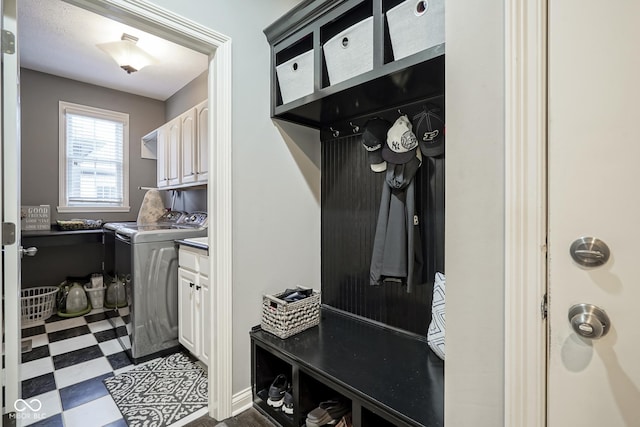 mudroom with washing machine and clothes dryer