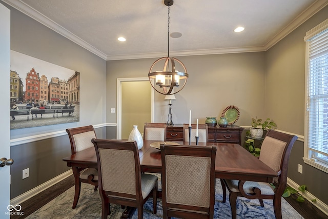 dining space featuring a notable chandelier, crown molding, and dark hardwood / wood-style flooring