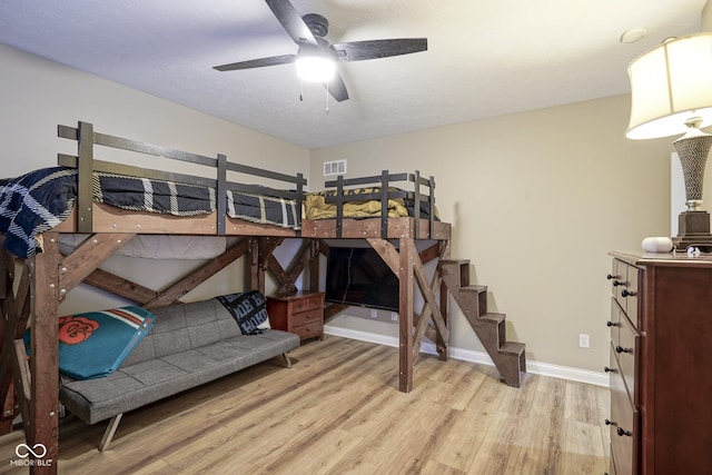 bedroom featuring ceiling fan and light hardwood / wood-style floors