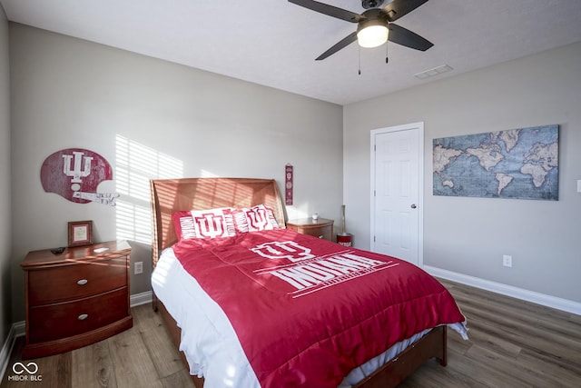 bedroom featuring ceiling fan and hardwood / wood-style flooring