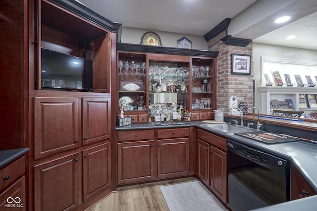 bar with sink, light hardwood / wood-style floors, and black dishwasher