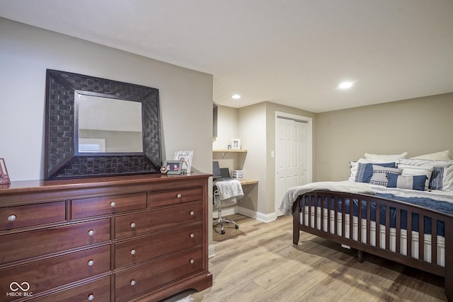 bedroom with a closet and light wood-type flooring