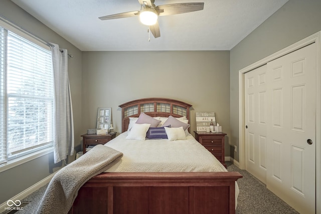 carpeted bedroom featuring a closet and ceiling fan