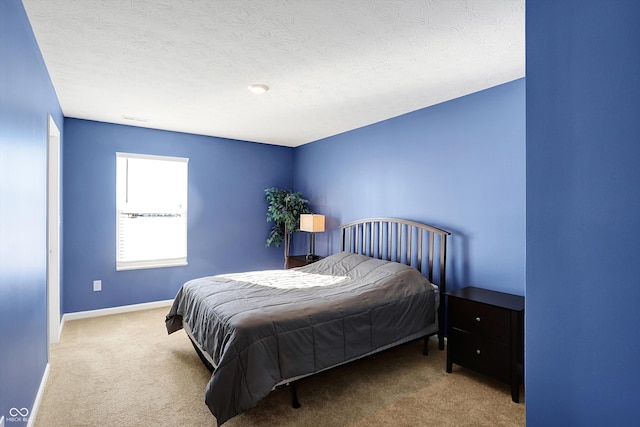 carpeted bedroom with a textured ceiling