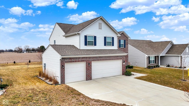 traditional home featuring a garage, brick siding, driveway, roof with shingles, and a front yard