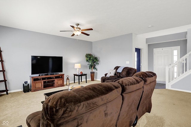 977 Capricorn Dr, Franklin, IN 46131 - living area with a ceiling fan, stairs, baseboards, and carpet